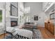 Bright living room with a modern fireplace and large windows providing natural light at 1564 S Uinta Way, Denver, CO 80231