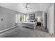 Spacious main bedroom features a ceiling fan, neutral decor and window overlooking the backyard at 1564 S Uinta Way, Denver, CO 80231