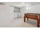 Finished basement area featuring laundry, and a foosball table for entertainment at 1736 Grove St, Denver, CO 80204