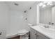 Clean, tiled bathroom featuring a walk-in shower, and modern fixtures at 1736 Grove St, Denver, CO 80204
