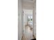 Hallway view into a bright bedroom with natural light and hardwood flooring at 1736 Grove St, Denver, CO 80204