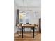 Bright dining area with hardwood floors and large windows offering plenty of natural light at 1736 Grove St, Denver, CO 80204