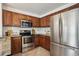 Kitchen featuring stainless appliances, including large refrigerator and gas range with microwave at 1736 Grove St, Denver, CO 80204