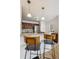 Kitchen with stainless appliances and bar seating on granite countertop at 1736 Grove St, Denver, CO 80204