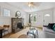 Cozy living room featuring a decorative fireplace, hardwood floors, and an inviting atmosphere at 1736 Grove St, Denver, CO 80204