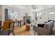 Bright living room featuring hardwood floors, ample natural light, and a decorative stone fireplace at 1736 Grove St, Denver, CO 80204