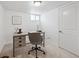 Comfortable home office with a modern desk setup, carpet, and good natural light at 1736 Grove St, Denver, CO 80204