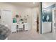 Bright bedroom with a built in desk and an ensuite bathroom with bold patterned tile at 2873 Cortina Ln, Evergreen, CO 80439