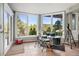 Bright game room with a drum set and beautiful views of the forest and mountains at 2873 Cortina Ln, Evergreen, CO 80439