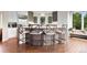 Modern kitchen island with seating, beautiful countertops, and ample natural light from surrounding windows at 2873 Cortina Ln, Evergreen, CO 80439