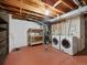 Unfinished basement with laundry hookups and storage at 9051 Bear Mountain Dr, Highlands Ranch, CO 80126