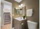 Updated bathroom with vanity and toilet at 9051 Bear Mountain Dr, Highlands Ranch, CO 80126