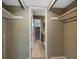 View of bathroom and stairs from a bedroom hallway at 9051 Bear Mountain Dr, Highlands Ranch, CO 80126