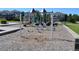 playground with swings and play structures at 9051 Bear Mountain Dr, Highlands Ranch, CO 80126