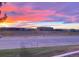 Scenic sunset view over the office park, with colorful clouds reflecting on the buildings at 9051 Bear Mountain Dr, Highlands Ranch, CO 80126