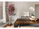 Close up on the dining table showcasing a potted plant and decorative vases, complementing the room's decor at 3725 Federal Blvd, Denver, CO 80211