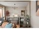 Open-concept dining room with modern lighting and stylish furniture at 3725 Federal Blvd, Denver, CO 80211