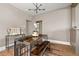 Well-lit dining room with a modern table and bench set, showcasing a stylish and inviting eating space at 3725 Federal Blvd, Denver, CO 80211