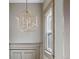Hallway featuring a modern light fixture, complementing the home's architectural design and style at 3725 Federal Blvd, Denver, CO 80211