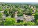 Expansive aerial view of a residential neighborhood showcasing tree-lined streets and well-maintained homes at 13246 Deneb Dr, Lone Tree, CO 80124