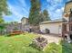 This backyard features a large grassy area, a fire pit, and a picnic table at 13246 Deneb Dr, Lone Tree, CO 80124