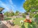 Enjoy this cozy backyard with well maintained lawn and a bench swing beneath a shady tree at 13246 Deneb Dr, Lone Tree, CO 80124