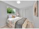 Cozy bedroom featuring a comfortable queen bed and a bright window with lush views at 13246 Deneb Dr, Lone Tree, CO 80124