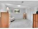 Well-lit bedroom with carpet floors, a large window, and a dresser at 13246 Deneb Dr, Lone Tree, CO 80124