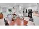 Inviting dining area connecting the kitchen and living room, perfect for entertaining and Gathering meals at 13246 Deneb Dr, Lone Tree, CO 80124