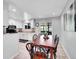 Bright dining area featuring modern lighting and a sliding glass door to the backyard at 13246 Deneb Dr, Lone Tree, CO 80124