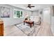 Bright living room features a large bay window and neutral décor for a cozy atmosphere at 13246 Deneb Dr, Lone Tree, CO 80124