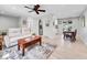 Open-concept living space features neutral paint, updated flooring, and seamless flow to the dining area at 13246 Deneb Dr, Lone Tree, CO 80124