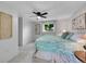 Bright main bedroom with large window, ceiling fan, carpet floors, and closet at 13246 Deneb Dr, Lone Tree, CO 80124