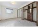 Well-lit bedroom with ample closet space and carpet at 7169 S Marshall St, Littleton, CO 80128