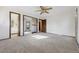 Spacious bedroom with mirrored closet doors and carpet at 7169 S Marshall St, Littleton, CO 80128