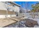 Side yard patio with fountain and partial view of house at 7169 S Marshall St, Littleton, CO 80128