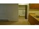 View from kitchen to a dedicated laundry area, enhancing functionality and convenience at 14806 E 2Nd Ave Ave # 105G, Aurora, CO 80011
