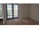 A living room with sliding glass doors that bring in lots of sunlight at 14806 E 2Nd Ave Ave # 105G, Aurora, CO 80011