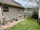 Backyard with lush lawn, stone foundation, and privacy fence at 26212 Center Dr, Kittredge, CO 80457