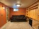 Finished basement features cozy seating, built in shelving, and a small window at 26212 Center Dr, Kittredge, CO 80457