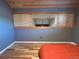 Bedroom with wood floors, wood ceiling, and unique window at 26212 Center Dr, Kittredge, CO 80457