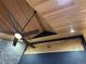 Vaulted ceiling with rustic wood planks and a stylish ceiling fan at 26212 Center Dr, Kittredge, CO 80457