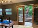 Dining area with direct access to a wood deck and backyard at 26212 Center Dr, Kittredge, CO 80457