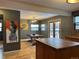 Inviting dining room with wood floors, stylish lighting, and a large table at 26212 Center Dr, Kittredge, CO 80457
