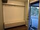 Bright entryway featuring a cushioned bench and a coat rack with hooks at 26212 Center Dr, Kittredge, CO 80457