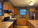 Well-equipped kitchen with tile countertops and stainless steel appliances at 26212 Center Dr, Kittredge, CO 80457