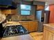 Well-equipped kitchen with wood cabinets, tile backsplash, and stainless steel appliances at 26212 Center Dr, Kittredge, CO 80457