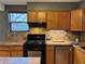 Kitchen featuring wood cabinets, tile countertops, and stainless steel appliances at 26212 Center Dr, Kittredge, CO 80457