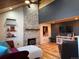 Stylish living room featuring a stone fireplace and modern decor at 26212 Center Dr, Kittredge, CO 80457