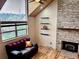Cozy living room with stone fireplace, hardwood floors, and comfortable seating at 26212 Center Dr, Kittredge, CO 80457